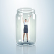 Businesswoman inside glass jar