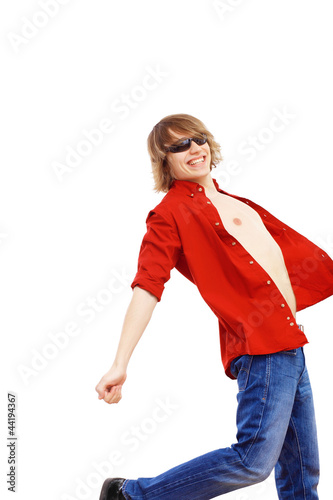 Photo: Happy smiling young man dancing Happy smiling young man dancing