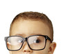 portrait of kid wearing glasses against a white background