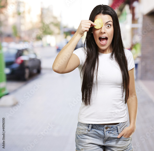 Photo: woman with a potatoe chip woman with a potatoe chip