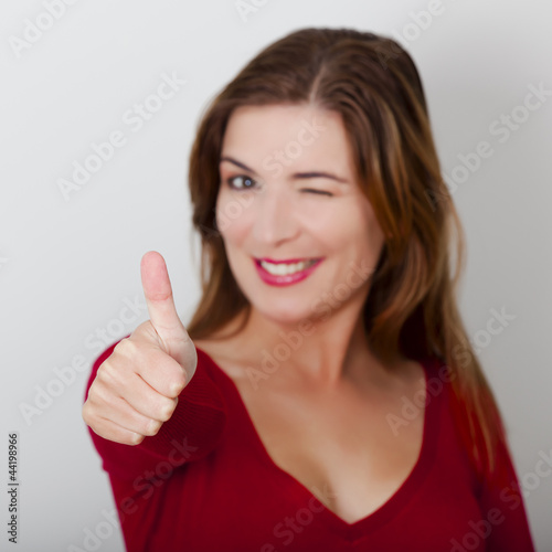Foto: Happy woman with thumbs up Happy woman with thumbs up