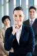 beautiful young businesswoman and team portrait