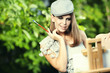 Fashion woman is painting. Open air session.