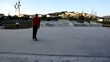 Skateboarder grinding a curb