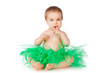 Cheerful little girl in a green skirt