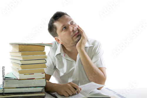 Photo: Man reading book in the library Man reading book in the library