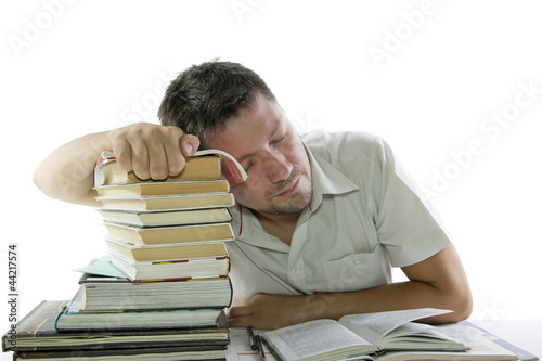 Photo: Man sleep and reading book in the library Man sleep and reading book in the library