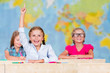 Foto: Back to school - elementary school pupil raising hand Back to school - elementary school pupil raising hand