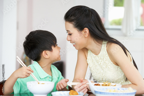 Photo: Chinese Mother And Son Sitting At Home Eating A Meal Chinese Mother And Son Sitting At Home Eating A Meal