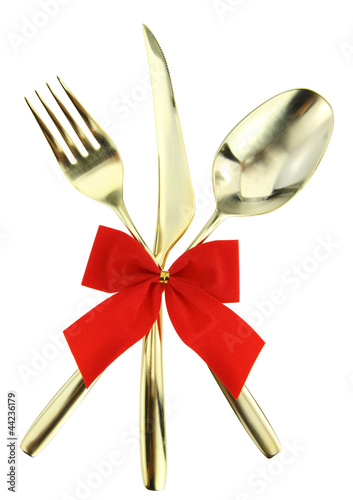 Photo: Christmas cutlery. Spoon, fork and knife on white background Christmas cutlery. Spoon, fork and knife on white background