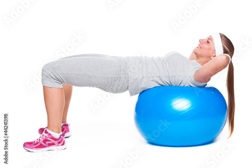 Photo: woman doing exercise on ball for abs woman doing exercise on ball for abs