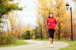Fall running - woman jogging in autumn