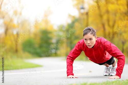 Photo: Crossfit woman doing push-ups Crossfit woman doing push-ups
