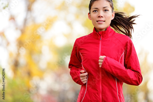 Photo: Woman runner running in autumn Woman runner running in autumn