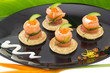 Photo: Red salmon roll with cheese, caviar and cucumber on” blinis” Red salmon roll with cheese, caviar and cucumber on” blinis”