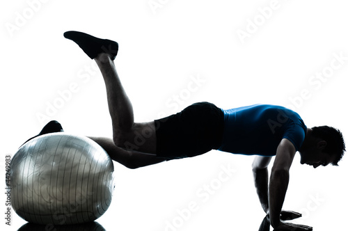 Photo: man exercising workout fitness ball posture man exercising workout fitness ball posture