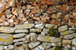 woodpile on stone wall