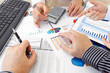 Hands with Financial  Charts  at Business Meeting in the Office