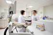Blurred laborants figures in laboratory