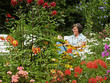 woman reading a book in the garden
