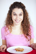 .Young woman eating toast