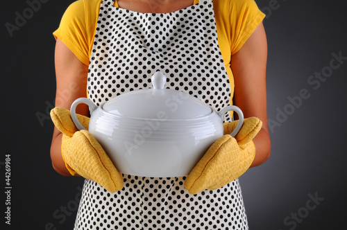 Photo: Woman Holding Soup Tureen Woman Holding Soup Tureen