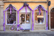Purple bike next to a lavender shop