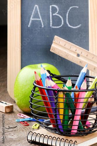 Photo: Chalkboard and colorful crayons Chalkboard and colorful crayons