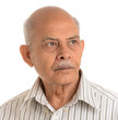 A portrait of a senior Indian man - isolated on white