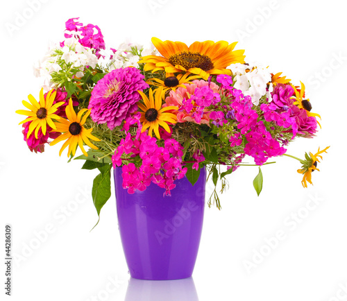 Photo: Beautiful bouquet of bright flowers isolated on white Beautiful bouquet of bright flowers isolated on white