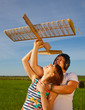 Girl and guy and model of airplane