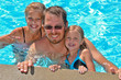 dad with daughters in pool