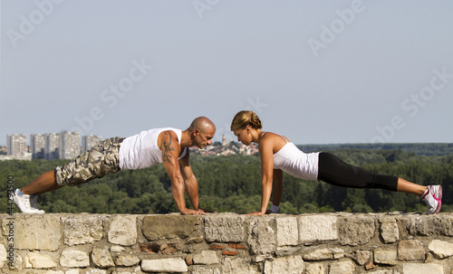 Photo: Pushups on a stone wall Pushups on a stone wall