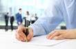Businessman is signing a contract