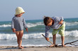 Photo: two happy children playing on beach two happy children playing on beach