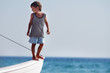 young happy boy on board of sea yacht