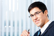 Portrait of smiling businessman at office