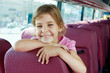 Photo: Closeup portrait of smiling girl on bus seat Closeup portrait of smiling girl on bus seat