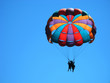 Paragliding in the clear sky