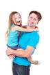 Smiling man holds his daughter on his hand.