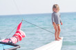 young happy child on ship on sea background