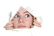 Photo: young girl looking through hole in paper young girl looking through hole in paper
