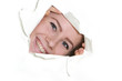 portrait of young happy woman looking through hole in paper