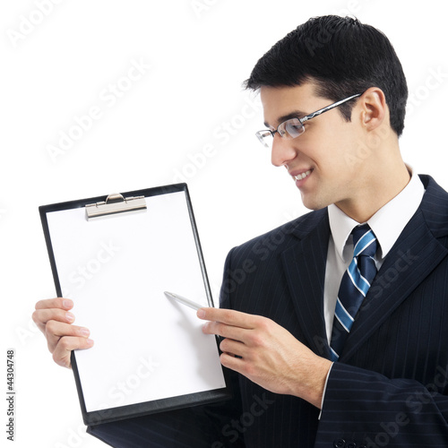 Foto: Businessman showing signboard, isolated Businessman showing signboard, isolated