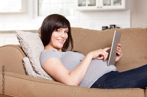 Photo: Pregnant Woman Using Digital Tablet Pregnant Woman Using Digital Tablet