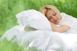 young beautiful woman sleeping on natural background
