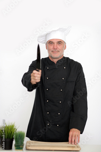 Photo: Koch mit scharfem Messer Koch mit scharfem Messer