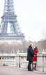 Romantic couple in love dating near the Eiffel Tower in Paris