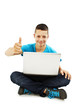 Photo: Man with laptop showing thumbs up Man with laptop showing thumbs up