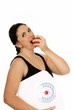 Foto: young woman with a weight scale and an apple young woman with a weight scale and an apple
